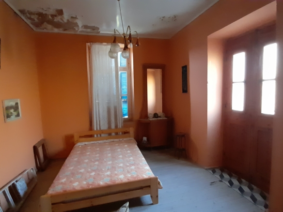 Andros-Apikia. House 280.49 m2 on 835.44 m2 land, with irrigation water, cistern and seaview.